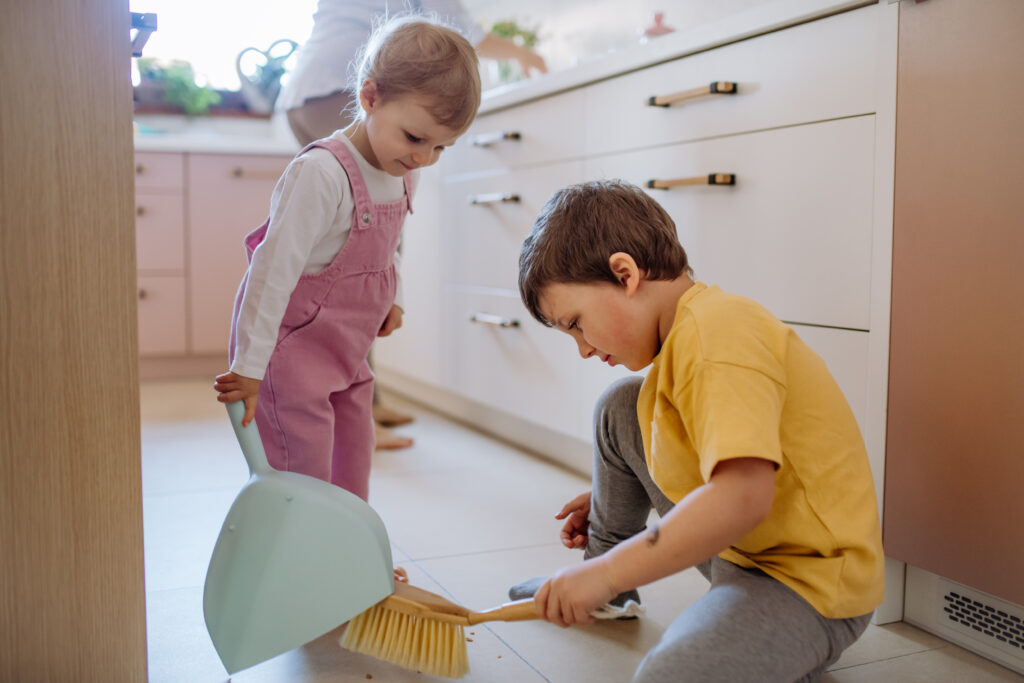 Kid Sweeping Up