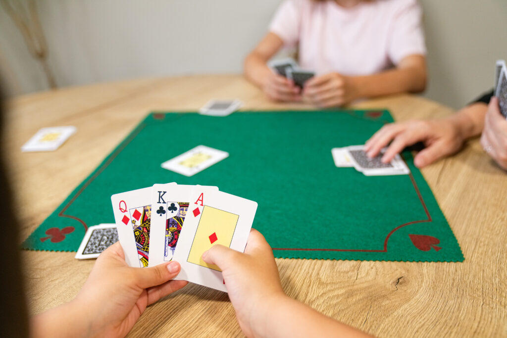 Playing Go Fish Game with a deck of cards